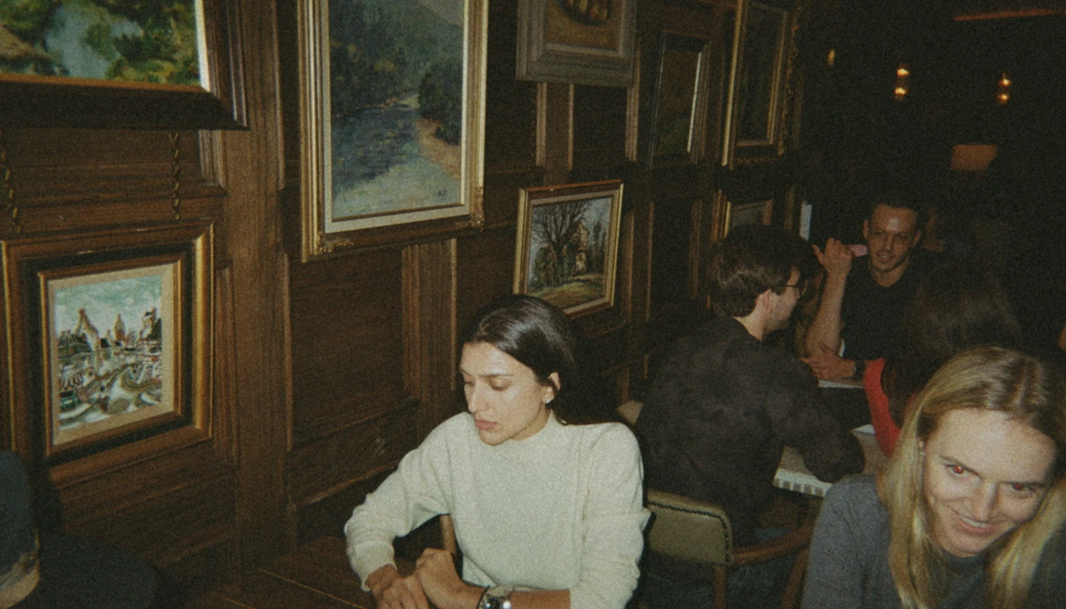 People with drinks and backgammon boards