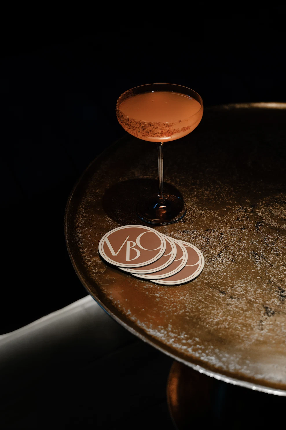 Cocktail with VBC coasters
